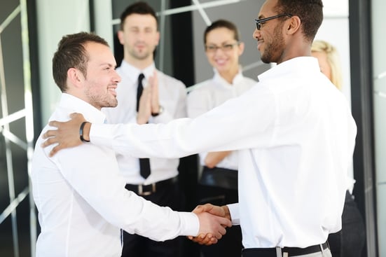 Business handshake after signing new contract