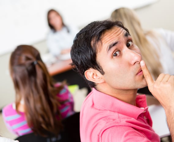 Male student asking for silence in the classroom