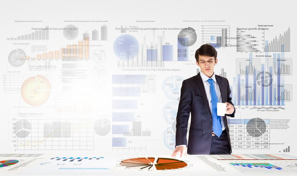 Young businessman and statistics information at background